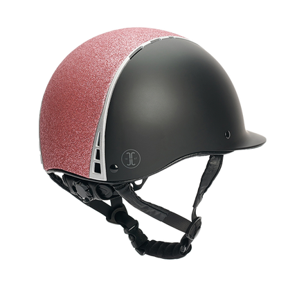 Jacson Philly Mips Ridhjälm Svart/Rosa är en säker, bekväm och stilfull ridhjälm som verkligen sticker ut med sina rosa glitterdetaljer!
